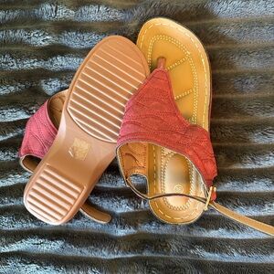 Several pair of sandals/shoes